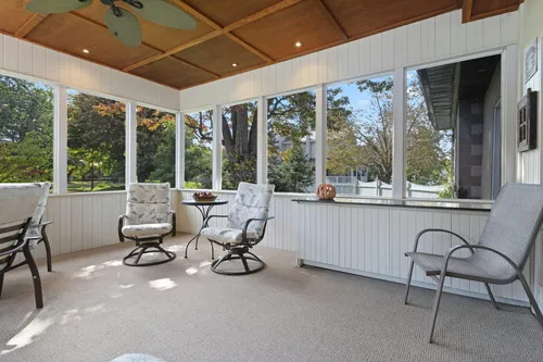 Screened-in sunroom with seating — illustrative stock photo, not an actual Las Vegas installation.
